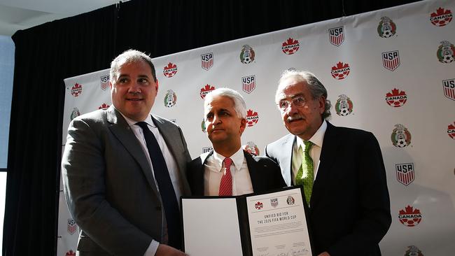 Sunil Gulati, (center) president of the United States Soccer Federation (USSF), Canadian CONCACAF President Victor Montagliani (left) and Mexican Football Federation President Decio De Maria hold up a signed unified bid for the 2026 soccer world cup