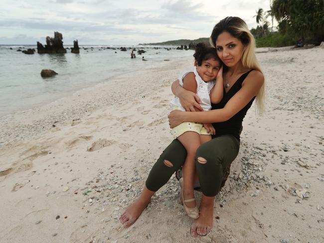 An Iranian refugee with her daughter on a beach on Nauru. They have been detained for five years. Picture: Lyndon Mechielsen