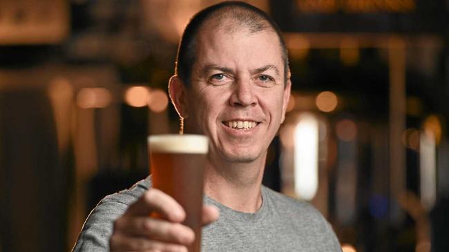 CHEERS: 4 Hearts Brewing head brewer Ken Friend with a glass of the newest batch of Wabbit Saison Carrot Beer. Picture: Cordell Richardson