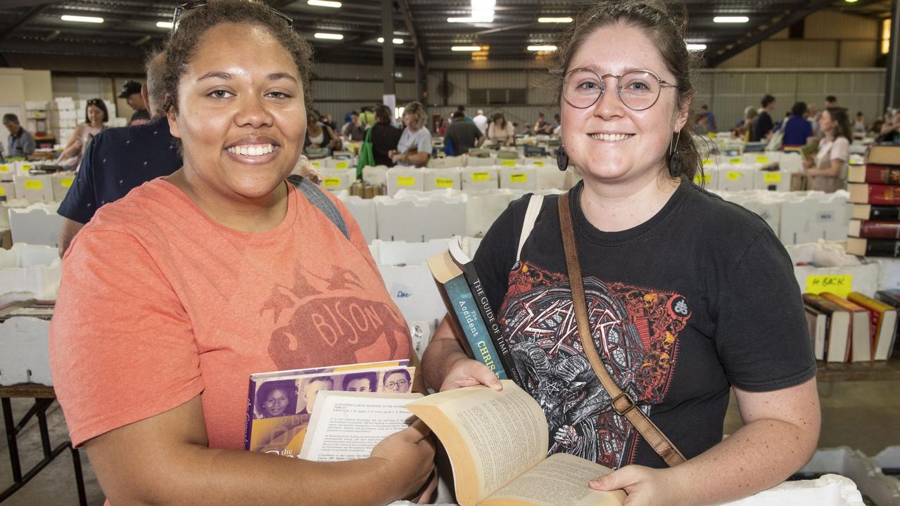 Sifting through the paperback section at Lifeline BookFest are Sophia Taylor (left) and Grace Hiscock. The Chronicle Lifeline BookFest at Toowoomba Showgrounds. Saturday, March 4, 2023. Picture: Nev Madsen.