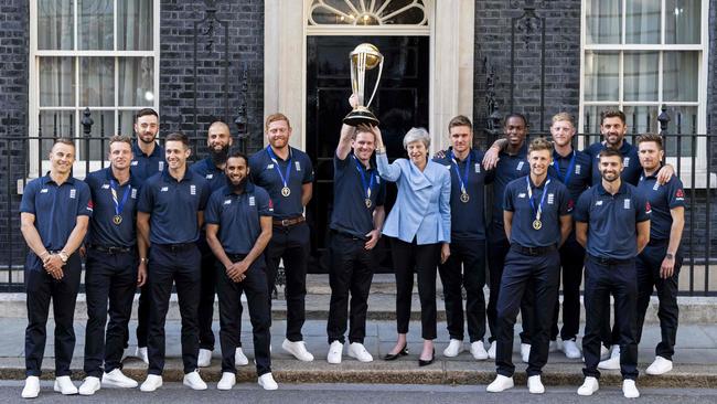 Archer and his England team-mates show off the World Cup trophy with then British Prime Minister Teressa May.