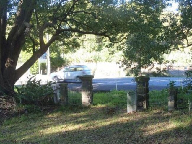 The cemetery gates before they were removed. Picture: supplied