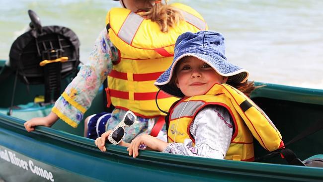 Lola is off for a paddle with her family on McCrae beach.