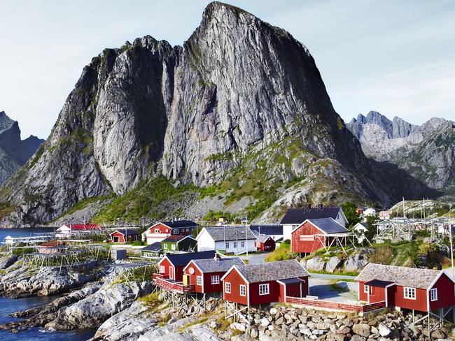 Lofoten Wall towering over fishing village in Norway, from Lonely Planet's Wild World