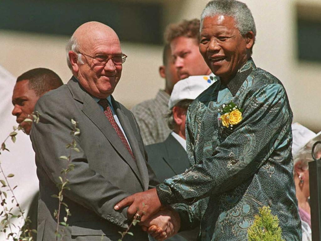 Then President Nelson Mandela holds hands with Deputy President Frederik W. De Klerk, at South Africa's Freedom Day celebration held in Pretoria city centre in 1996 to mark the second anniversary of all race elections, which ended whites-only rule. Picture: AFP