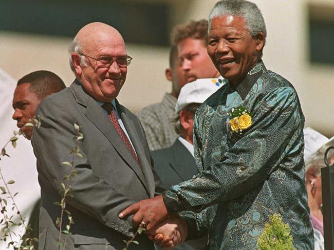 Then President Nelson Mandela holds hands with Deputy President Frederik W. De Klerk, at South Africa's Freedom Day celebration held in Pretoria city centre in 1996 to mark the second anniversary of all race elections, which ended whites-only rule. Picture: AFP