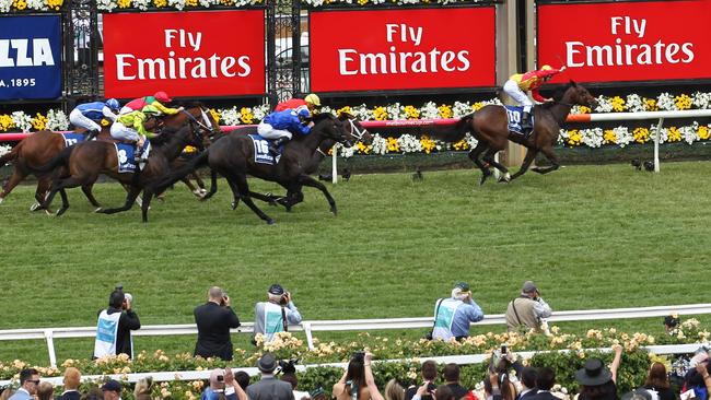 Race 4 at Flemington on Melbourne Cup Day. Yep, the winner raced on the rail all the way. AAP Image/David Crosling.