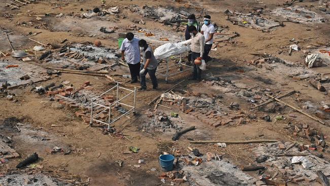 Relatives carry the body of a victim who died of COVID-19 at a cremation ground in New Delhi, India. Picture: Tauseef Mustafa/AFP