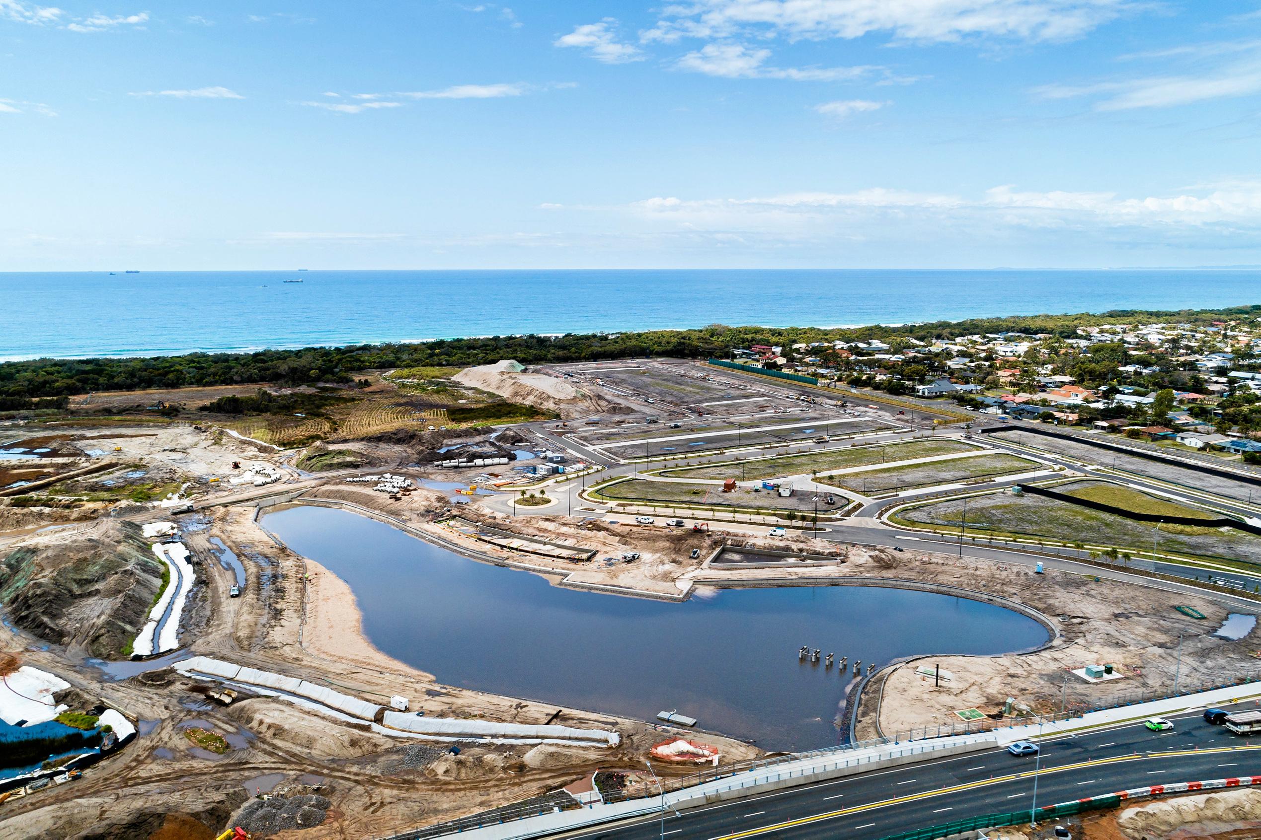 A number of milestones are within reach at Stockland's Oceanside development in Birtinya. Pictured are recent aerial photographs showing housing site and lake development in the Bokarina Beach residential area. Picture: Stockland