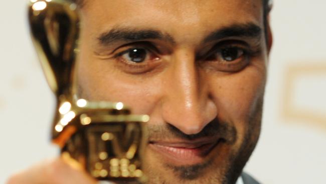 Waleed Aly clutches the Gold Logie.