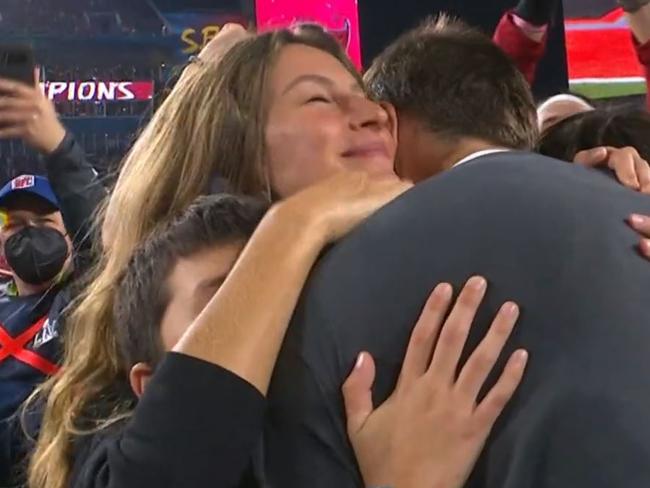 Tom Brady embraces his family.