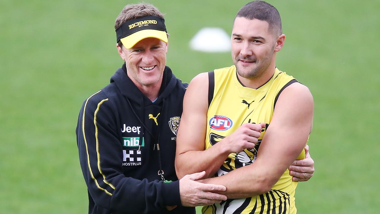 Damien Hardwick hugs Shaun Grigg at Richmond training. Picture: Getty Images