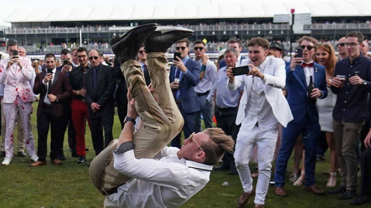 Air of celebration: A punter flips out late in the day. Picture: Scott Barbour/AAP