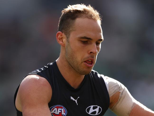 MELBOURNE, AUSTRALIA - JUNE 18: David Cuningham of the Blues controls the ball during the round 14 AFL match between Carlton Blues and Gold Coast Suns at Melbourne Cricket Ground, on June 18, 2023, in Melbourne, Australia. (Photo by Robert Cianflone/Getty Images)