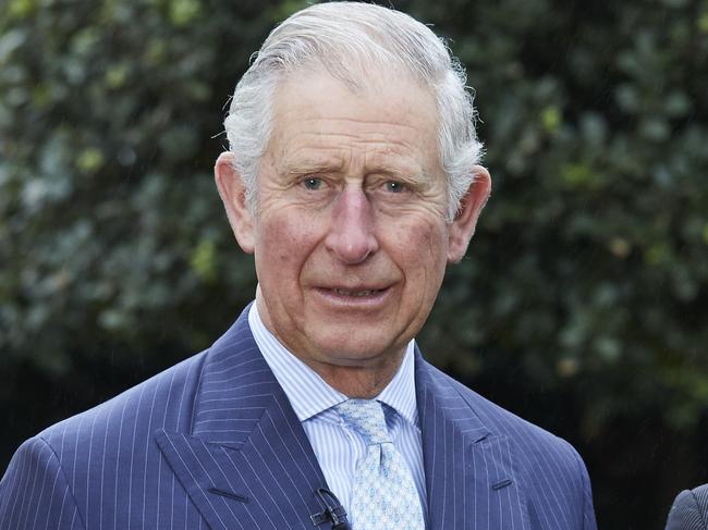 This image made available by Penguin Books Ltd shows from left, Emily Shuckburgh, a Cambridge University climate scientist, Prince Charles, long a critic of man-made climate change, and Tony Juniper, a former Friends of the Earth director. Prince Charles has co-authored a book on climate change. The book called "Climate Change" launched Sunday Jan. 15, 2017, and is part of Ladybird book series, which traditionally targeted children but has recently expanded to a broader audience. (Penguin Books Ltd via AP)