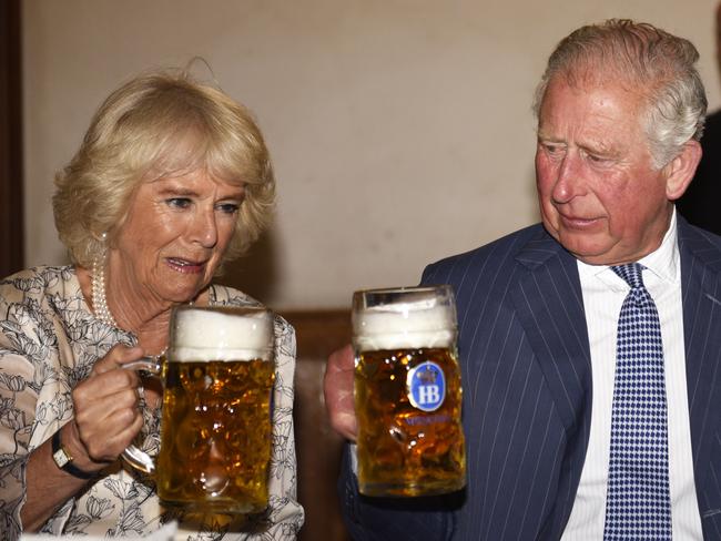 Camilla and Charles appear a bit daunted by their beers during a visit to Munich in May. Picture: Uwe Lein/Getty Images