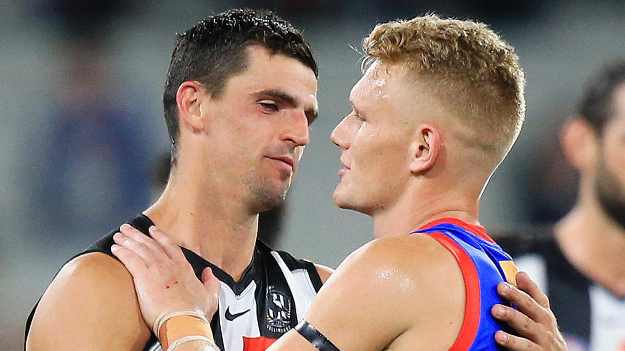 Scott Pendlebury and Adam Treloar embrace after Collingwood’s Round 1 game against Western Bulldogs.