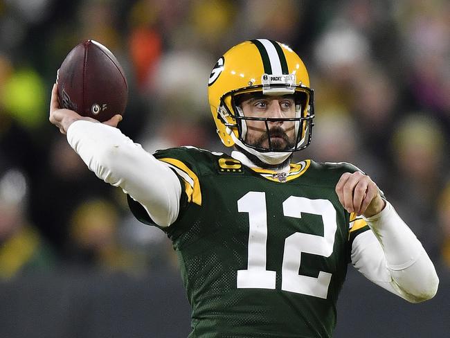 GREEN BAY, WISCONSIN - JANUARY 12: Aaron Rodgers #12 of the Green Bay Packers throws a pass against the Seattle Seahawks in the third quarter of the NFC Divisional Playoff game at Lambeau Field on January 12, 2020 in Green Bay, Wisconsin. (Photo by Quinn Harris/Getty Images)