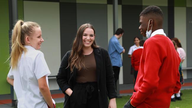 Associate teacher Ellen Parker, 22, with Year 7 students Scarlette Quinn and Emmanuel Momah at St Clare’s Catholic High School in Sydney’s west. Picture: Jane Dempster