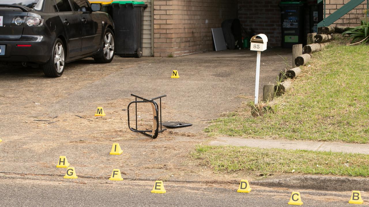 Evidence in Dickens Road in Ambarvale where last night a female died after a drive by shooting of a property. Picture: Julian Andrews