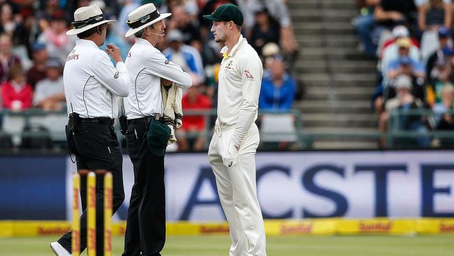 Cameron Bancroft is questioned by the umpires in Cape Town. Pic: AFP 