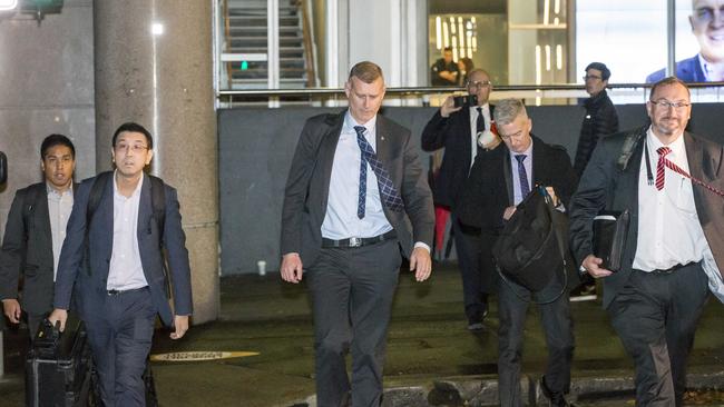 AFP officers leaving ABC headquarters after their raid. Picture: Damian Shaw