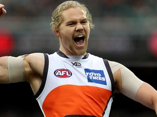 ADELAIDE, AUSTRALIA - JULY 22: Harry Himmelberg of the Giants celebrates a goal during the 2018 AFL round 18 match between the Port Adelaide Power and the GWS Giants at Adelaide Oval on July 22, 2018 in Adelaide, Australia. (Photo by James Elsby/AFL Media/Getty Images)