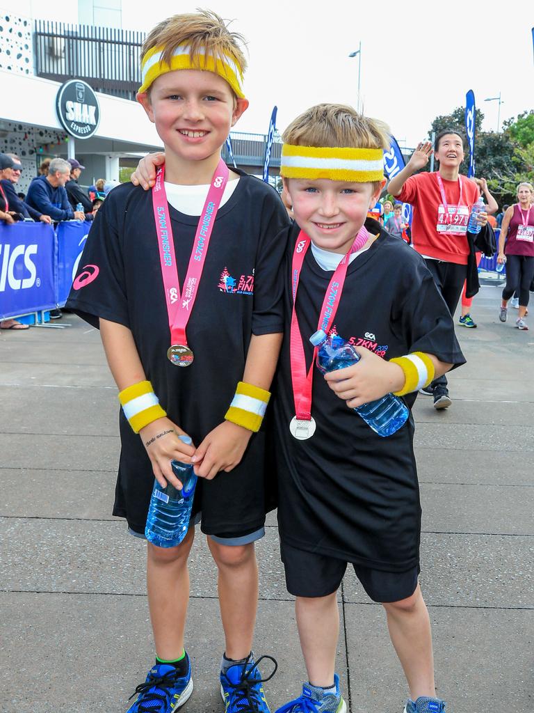 Callum Curtin, 8, and Aaron Curtin, 6 from Benowa at the end of the Gold Coast Airport Fun Run. Picture: Tim Marsden.