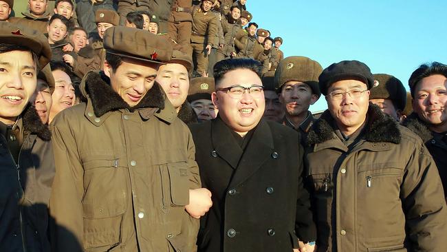 North Korean leader Kim Jong-un (centre), surrounded by soldiers of the Korean People's Army, inspects the test-launch of a surface-to-surface medium long-range ballistic missile. Picture: AFP/KCNA via KNS