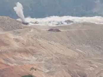 The first official blast as explosives are used to break up very hard rock to clear the way for the Coffs Harbour Bypass.