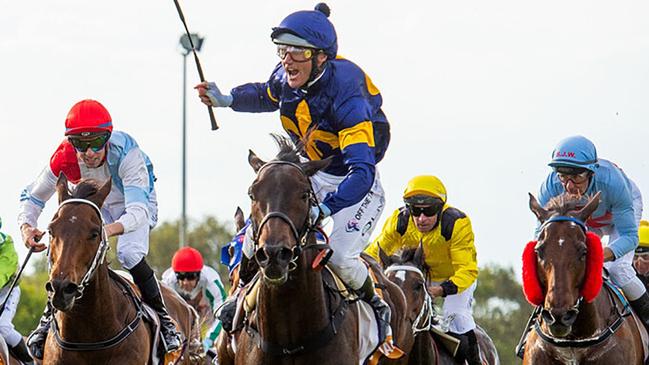 Damien Oliver celebrates after winning in his final race ride aboard Munhamek in the Gold Rush at Ascot last year. Picture: Jorja King