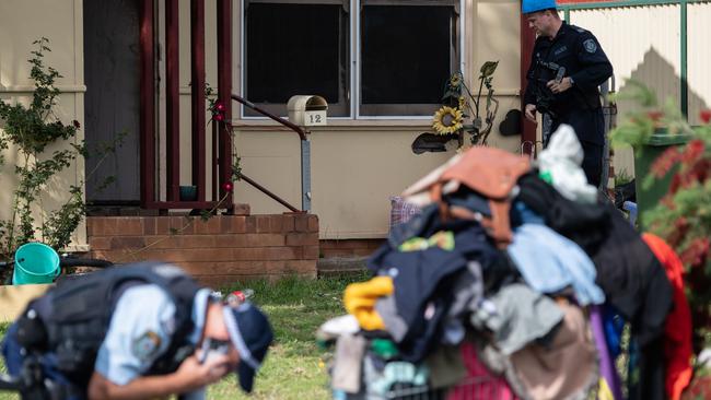 Police officers outside the Utzon Rd house today. Picture: James Gourley