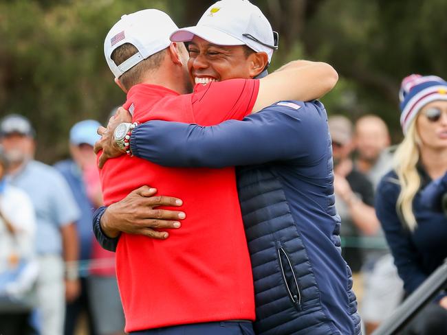 Tiger Woods hugs teammate Justin Thomas as the United States win the Presidents Cup.