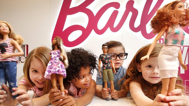 Barbie fans Mia 4, Hannah 3, Darcy 3 and Annie 4 play with their look-a-like Barbies and Ken dolls. Picture: David Caird