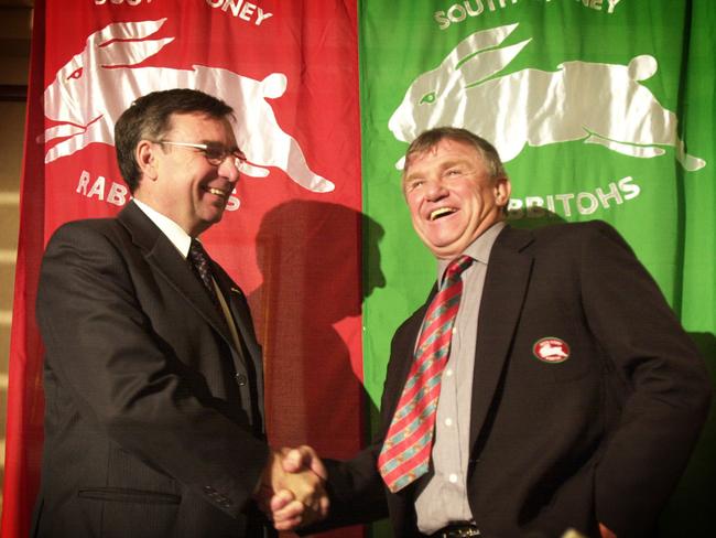 South Sydney chairman George Piggins (right) shakes hands with NRL chief executive David Moffett after their meeting to confirm the Rabbitohs would be the Telstra Premiership's 15th club in 2002. Picture: Mark Williams
