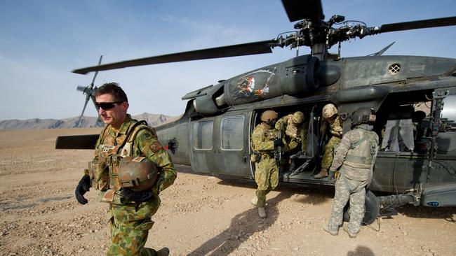 Major General Angus Campbell steps off a Black Hawk helicopter to visit troops at a patrol base in Uruzgan Province. Picture: SGT Neil Ruskin