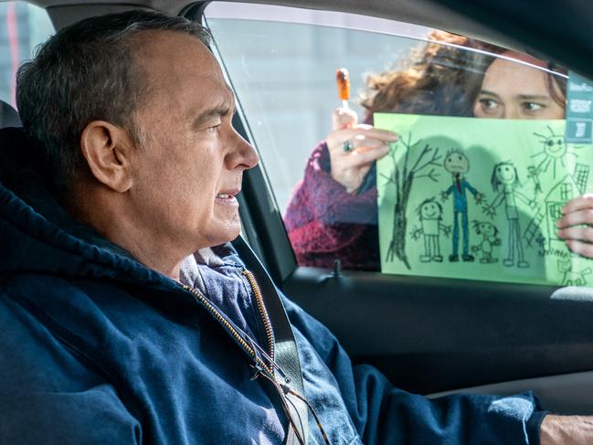 Otto (Tom Hanks) is loathe to react to the picture Marisol's (Mariana Trevino) kids drew in Columbia Pictures A MAN CALLED OTTO.