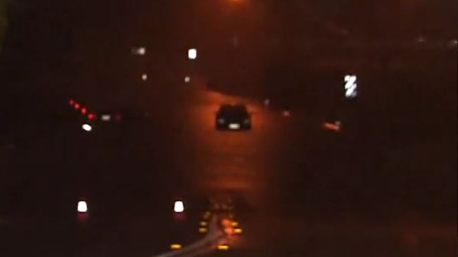 A car stuck in floodwaters in Rocklea late on Thursday night. Credit: 9News QLD