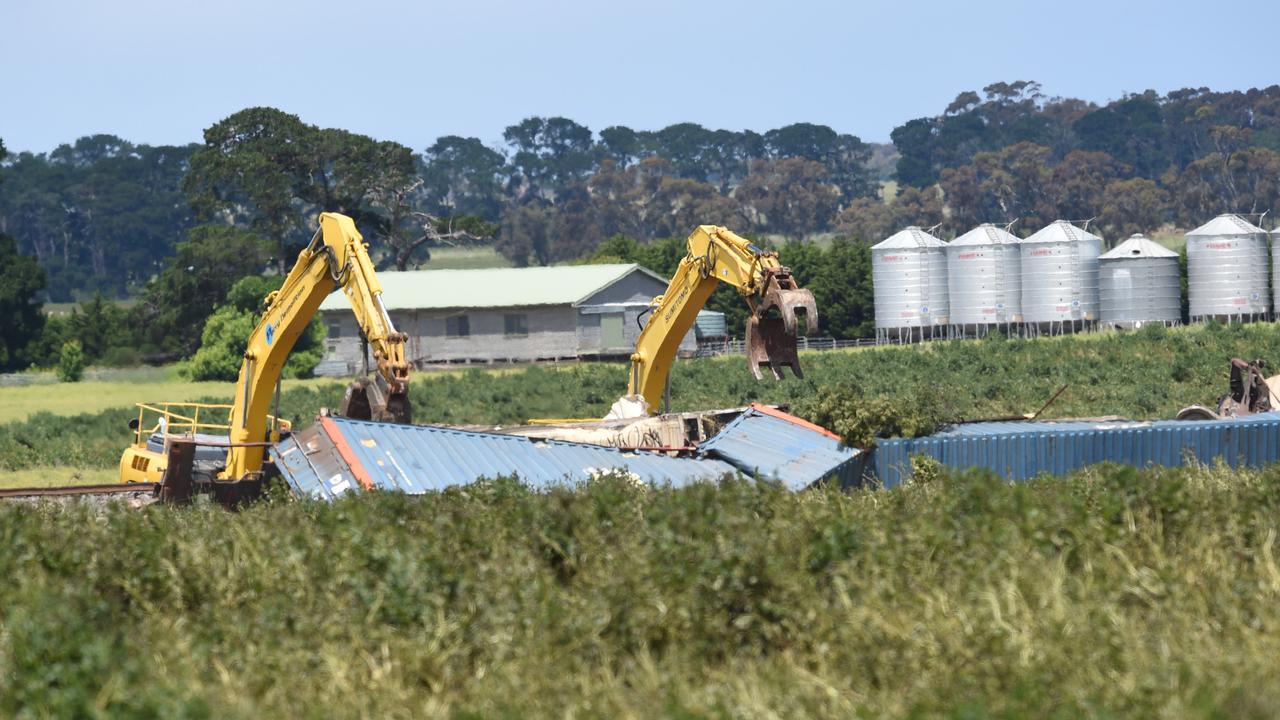 Excavators are being used to clear the derailed trains from the track. Picture: David Smith