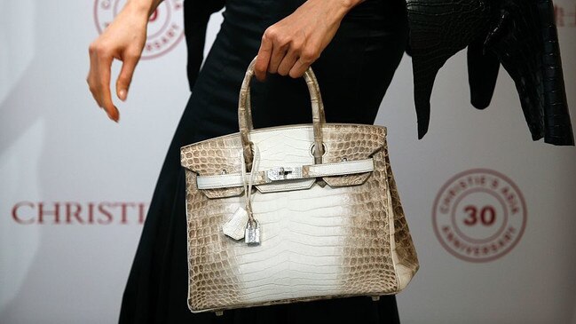 A Hermes Matte White Himalaya Niloticus Crocodile Diamond Birkin with 18K gold and diamond hardware — one of the most valuable handbags in the world.