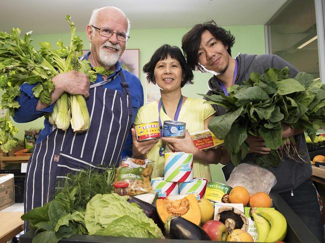 Asylum Seeker Resource Centre food bank volunteers Brian Derum, Uyen Nguyen and Dave Hu. Picture: Ellen Smith