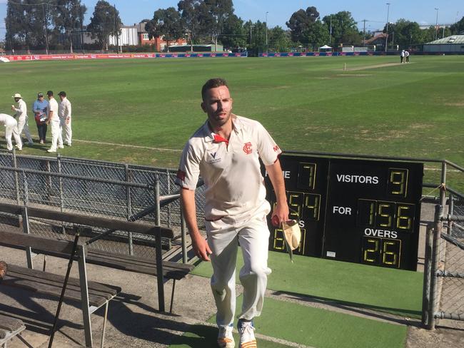 Essendon Premier Cricket paceman Matt Doric leads the team off after his maiden 10-wicket haul against Kingston Hawthorn.