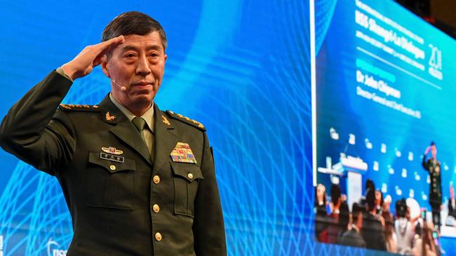 China's Minister of National Defence Li Shangfu salutes the audience before delivering a speech during the 20th Shangri-La Dialogue summit in Singapore. Picture: AFP.