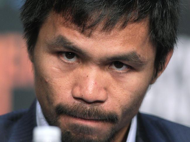 WBO welterweight champion Manny Pacquiao listens during a news conference at the KA Theatre at MGM Grand Hotel & Casino on April 29, 2015 in Las Vegas, Nevada. Pacquiao will face WBC/WBA welterweight champion Floyd Mayweather Jr. in a unification bout on May 2, 2015 in Las Vegas. AFP PHOTO / JOHN GURZINSKI