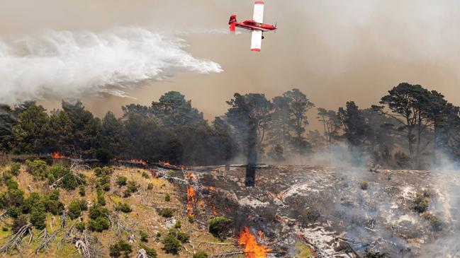 Helicopter water bombers were deployed to help combat the scrub fire in Mount Gambier which continues to burn overnight. Picture: Tim Rosenthal