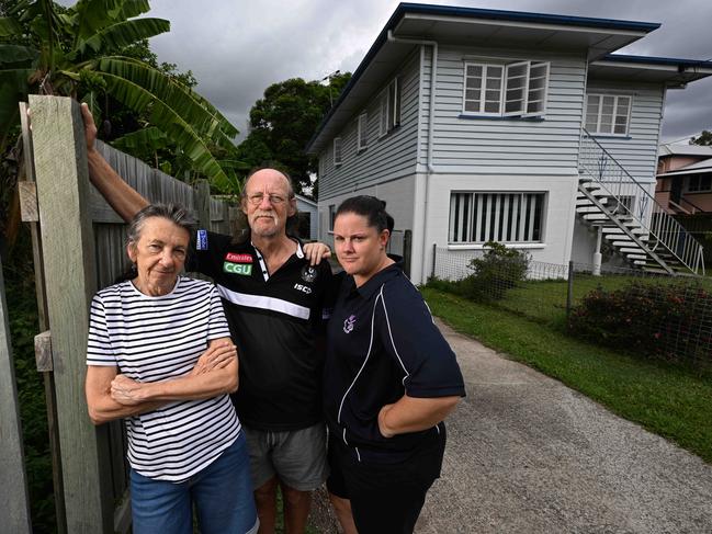 Lisa Donaldson and her parents Ross and Jenny Donaldson, outside their home that flooded in 2022. Picture: Lyndon Mechielsen