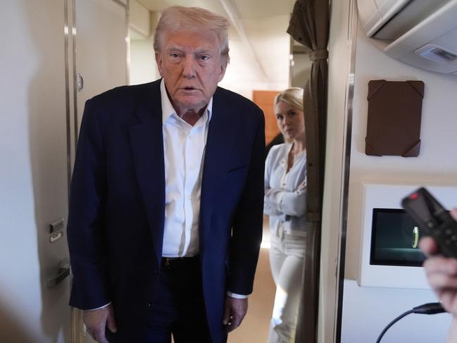 President Donald Trump talks with reporters on Air Force One as he heads back to Washington, Sunday, May 4, 2025, from West Palm Beach, Fla. (AP Photo/Manuel Balce Ceneta)