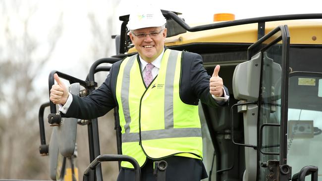 Prime Minister Scott Morrison poses on a construction vehicle after giving the order for work to commence on the Western Sydney airport. Picture: Getty Images