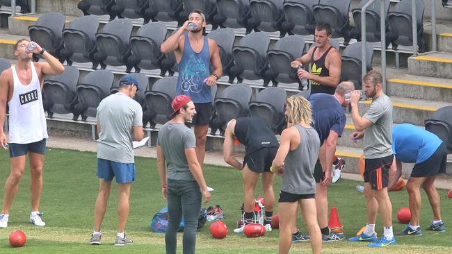 A number of the banned Bombers, including suspended captain Jobe Watson, centre, have been training as a group. Picture: Hamish Blair