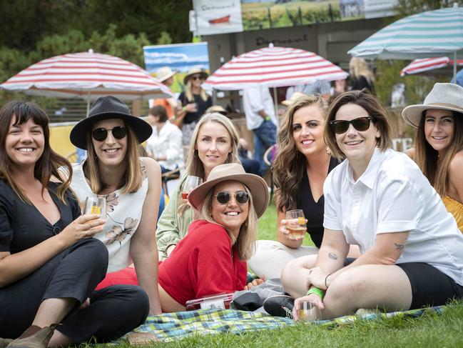 Friends enjoying the sunshine at the Tasmanian Wine Festival at the Royal Tasmanian Botanical Gardens. Picture: Chris Kidd